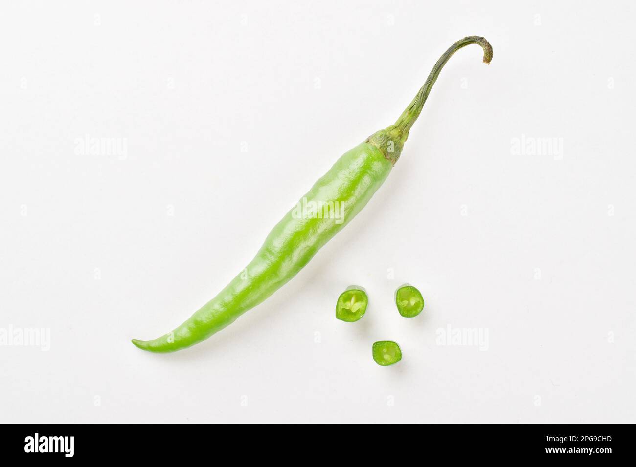 Top view of green chilli on white background Stock Photo - Alamy