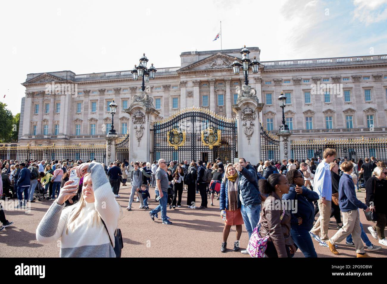 People gather around Buckingham Palace on the first Saturday since the state funeral of the late Queen Elizabeth II. Stock Photo