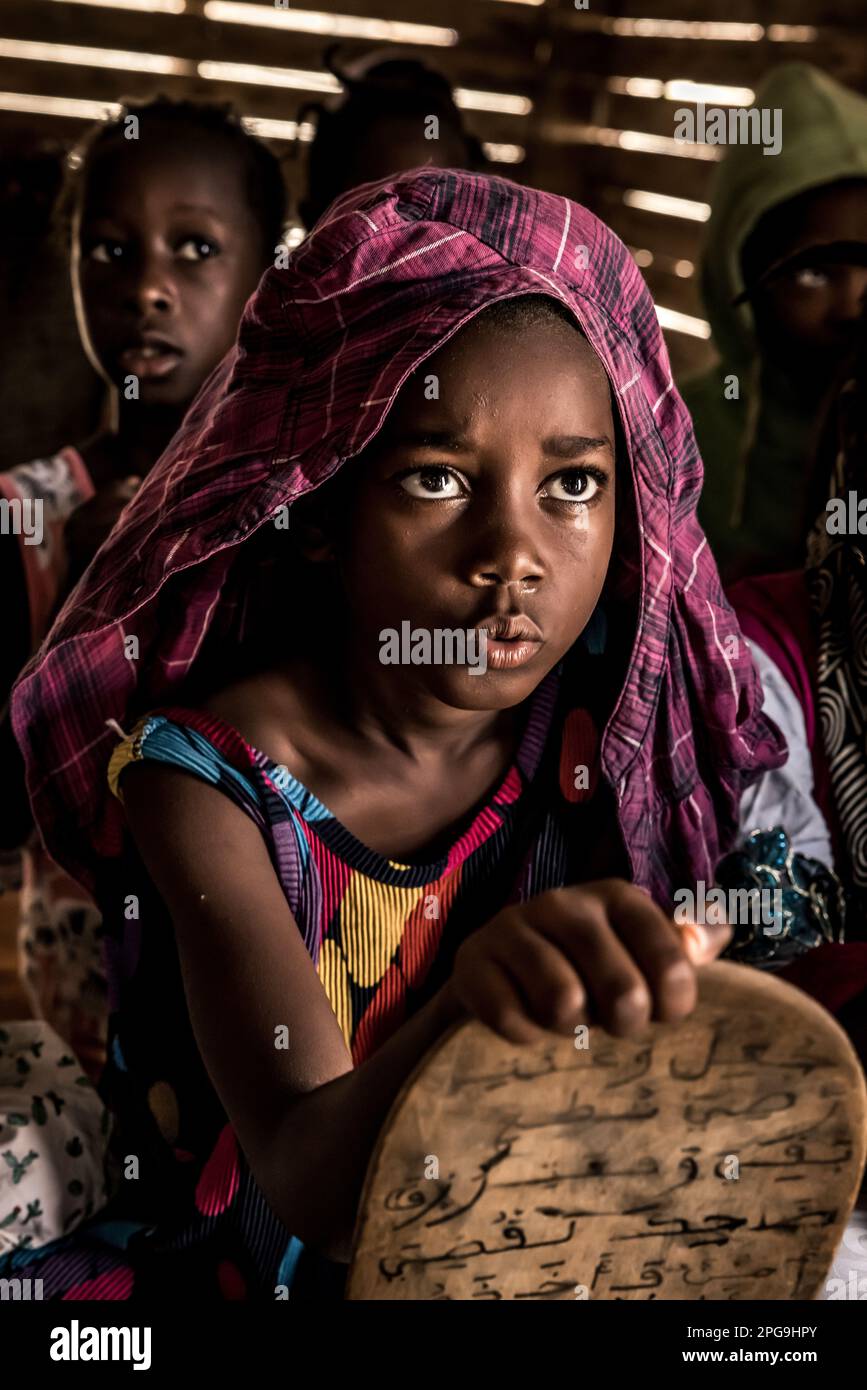 Children in the Koranic school in the Darbedda district, mainly belong to the disadvantaged Haratin tribe and are able to attend the Koranic school thanks to the help of the NGO Sahel Fondation of Brahim Ramdhane in Nouakshott in Mauritania. Stock Photo
