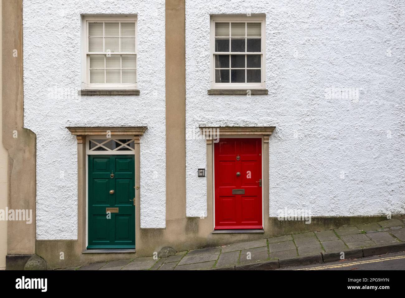 Two house frontages decorated with green and red doors around Brandon Hill in Bristol, England, UK Stock Photo