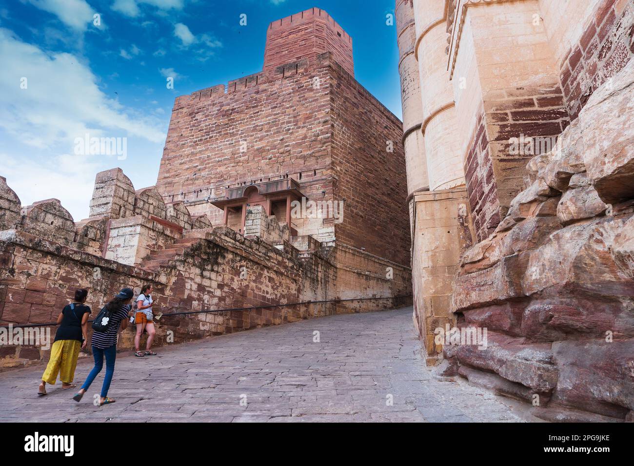 Jodhpur, Rajasthan, India - 19th October 2019 : Indian and foreigner women tourists climbing up famous Mehrangarh fort, UNESCO world heritage site. Stock Photo