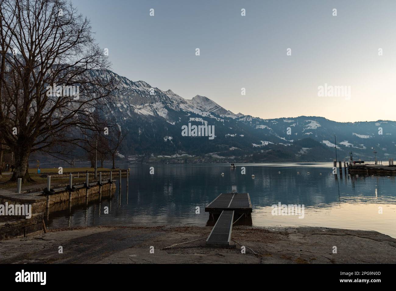Unterseen, Canton Bern, Switzerland, February 12, 2023 Mountain scenery at the lake of Thun in the lake afternoon Stock Photo
