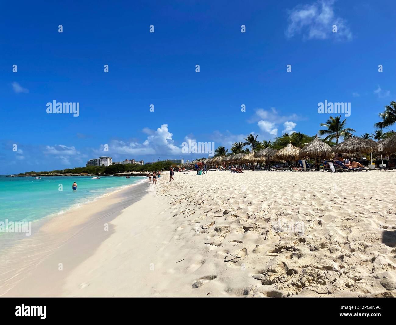 Eagle Beach, Oranjestad, Aruba - March 8, 2022. People on the beach and ...