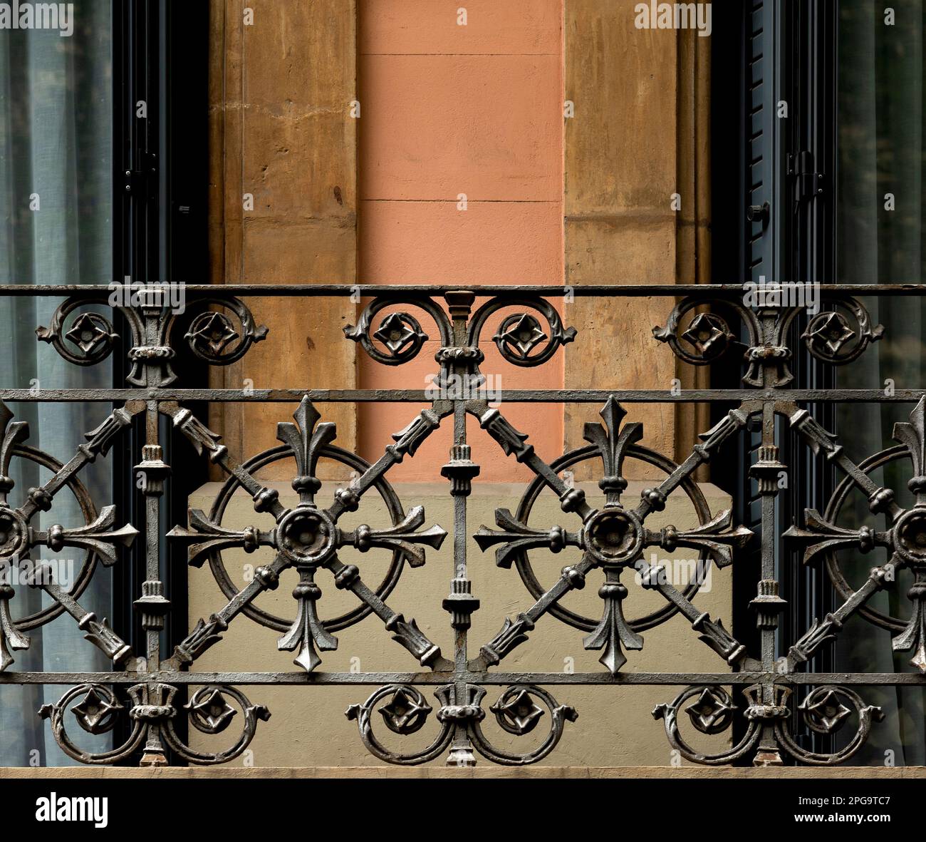 Shot in color detail on the facade of this historic building representing some character, animal or flower. Set at Eixample, Barcelona, Catalunya, Stock Photo