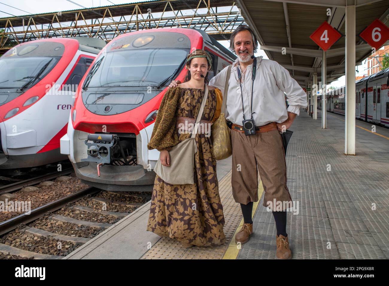 Actors performing Don Quixote de la Mancha and Dulcinea del Toboso inside the Cervantes Train between Atocha train Station and Alcala de Henares, Madr Stock Photo