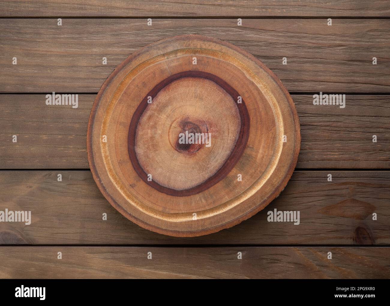 Empty rustic wooden board over wooden table. Stock Photo