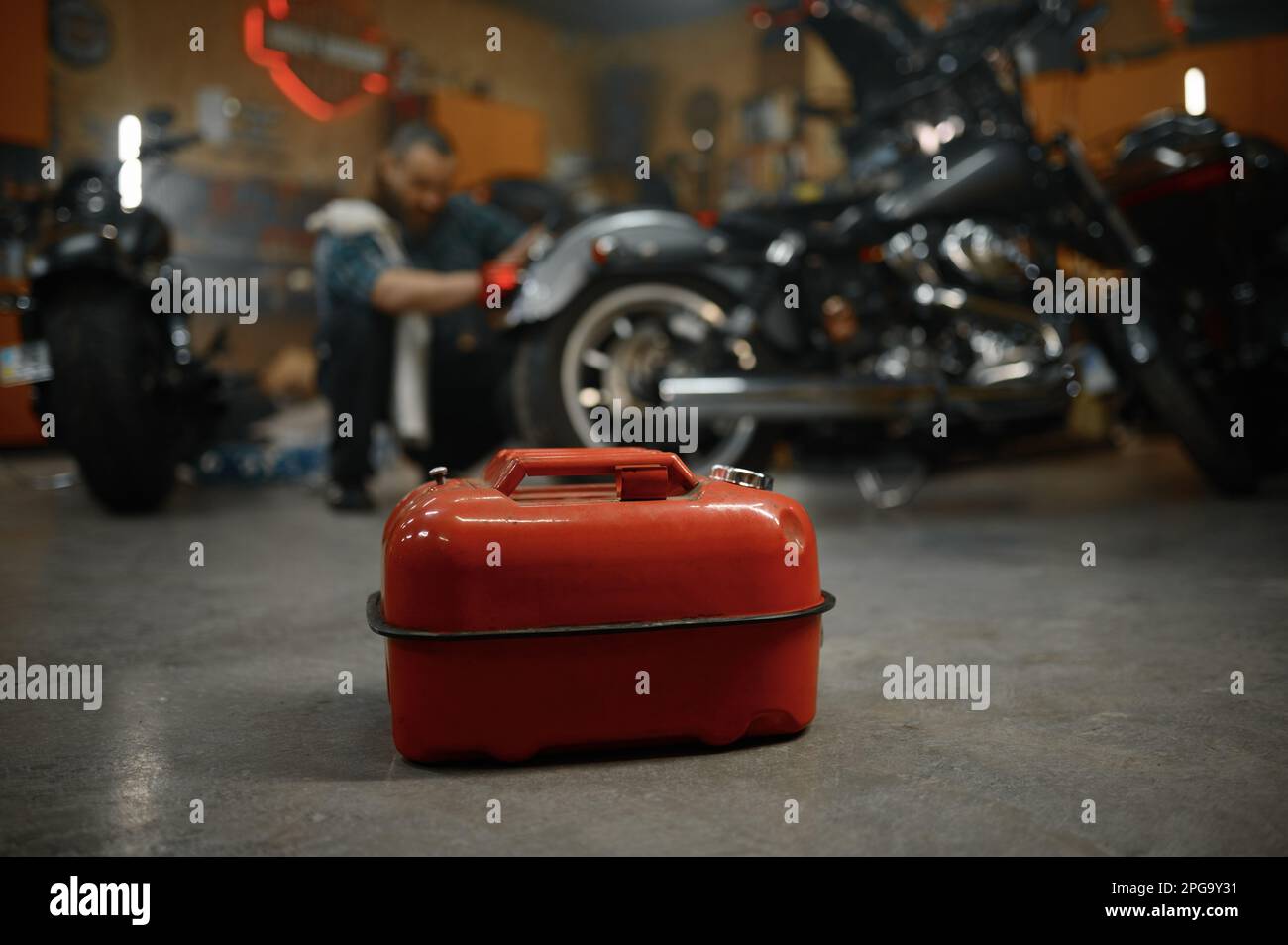 Selective focus on fuel canister in motorcycle garage Stock Photo Alamy