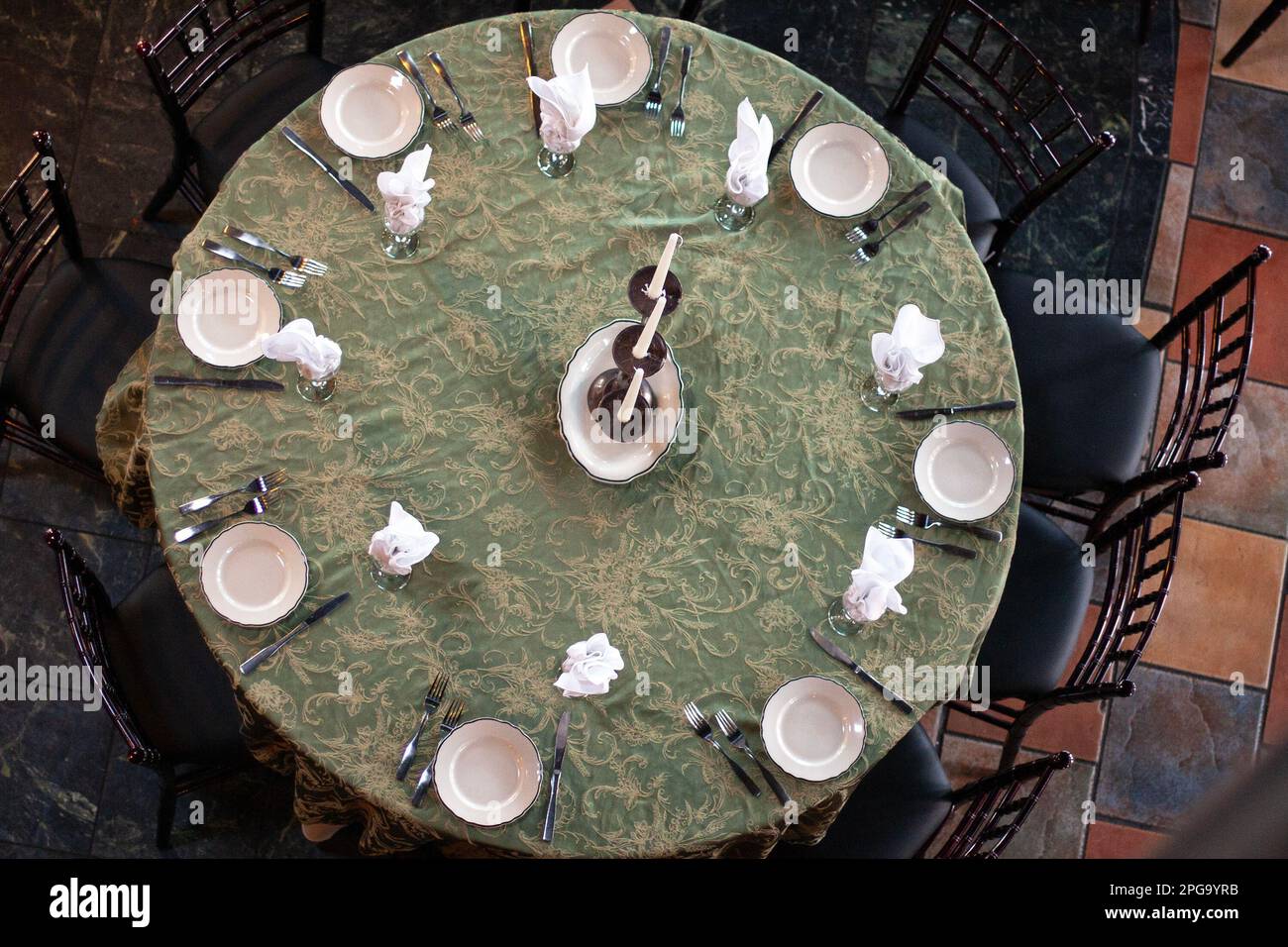 A table for eight is set and ready for guests. Stock Photo