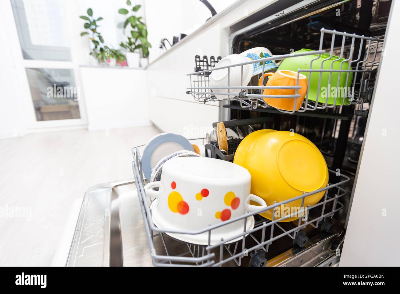 dishwasher closeup with washed dishes, easy to use and save water, eco