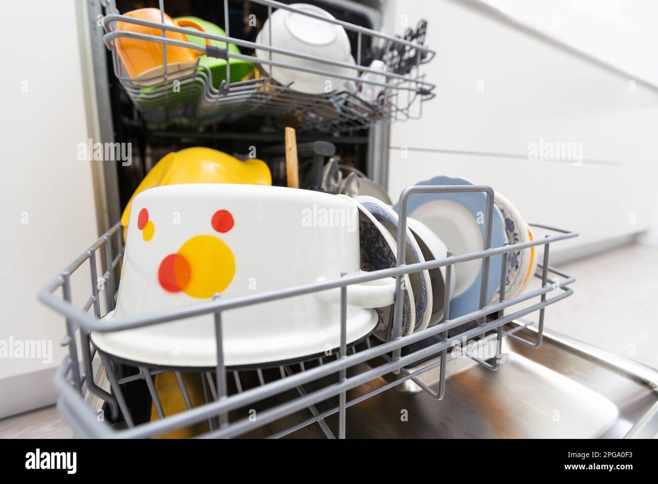 dishwasher closeup with washed dishes, easy to use and save water, eco