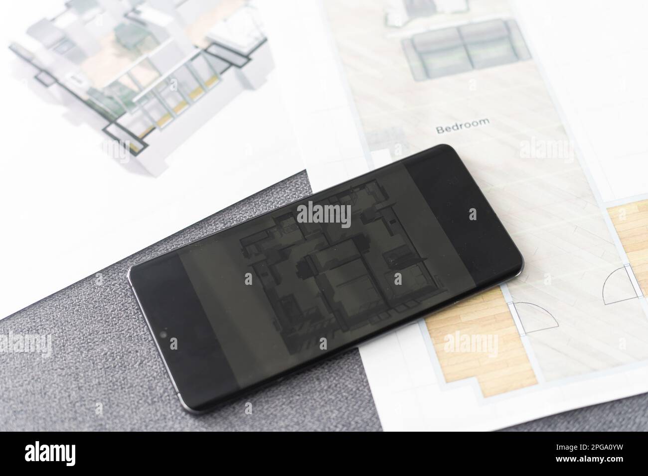 website wireframe sketch and programming code on smartphone Stock Photo