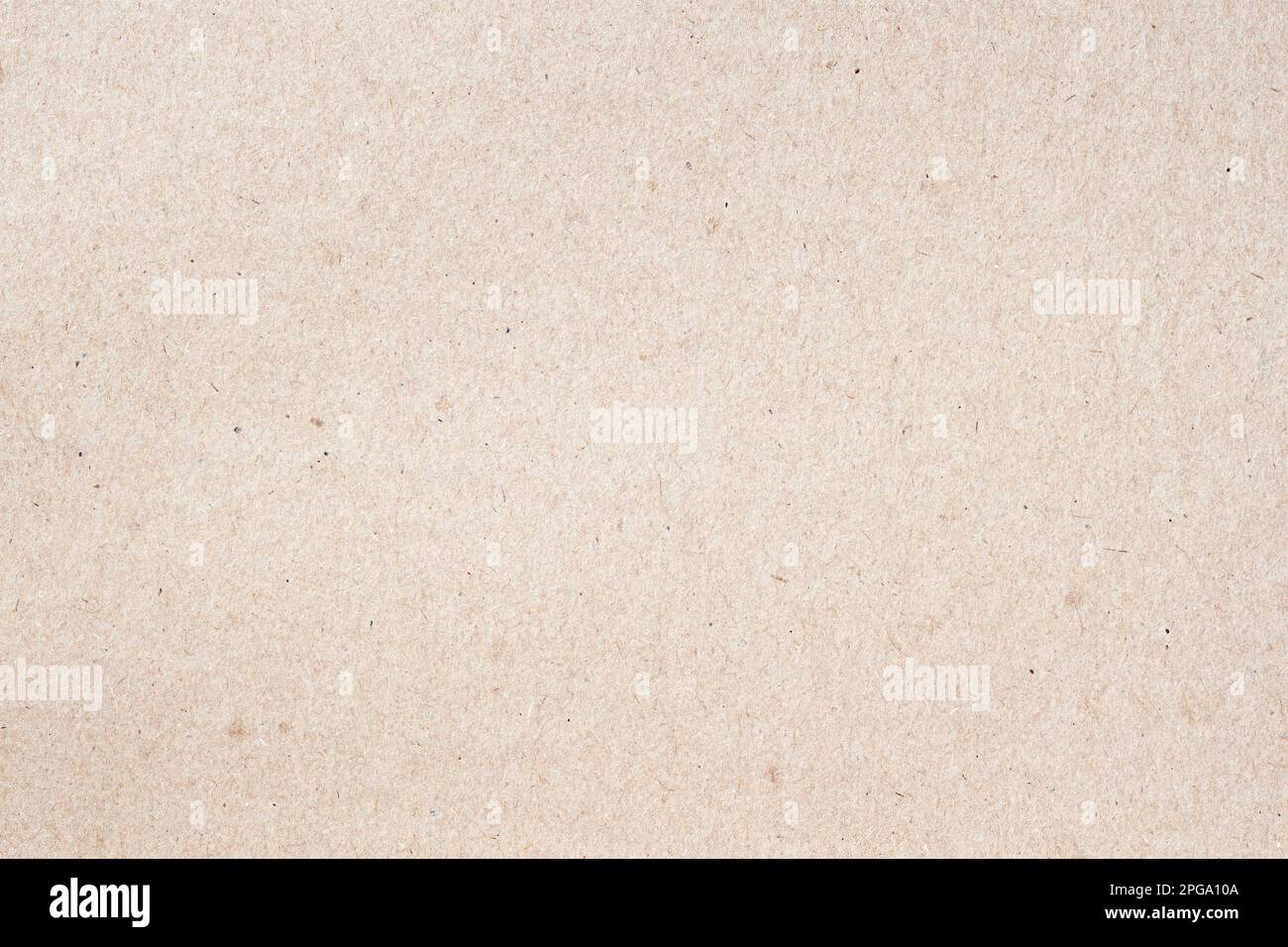 Texture of paper, cardboard, recyclable material with various villi, fluff, other inclusions