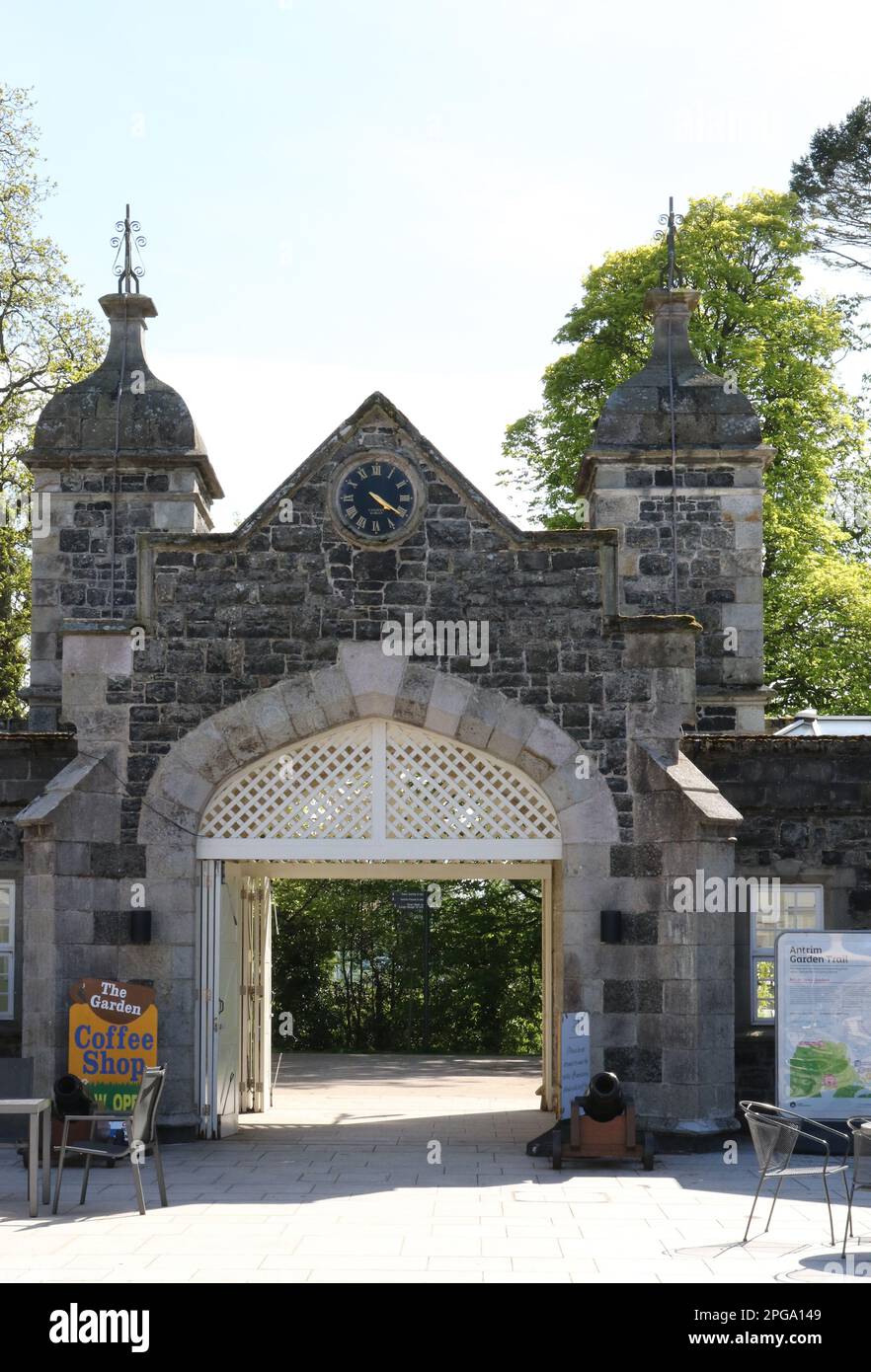 Wall mounted clock, towers and gateway at Clotworthy House in Antrim