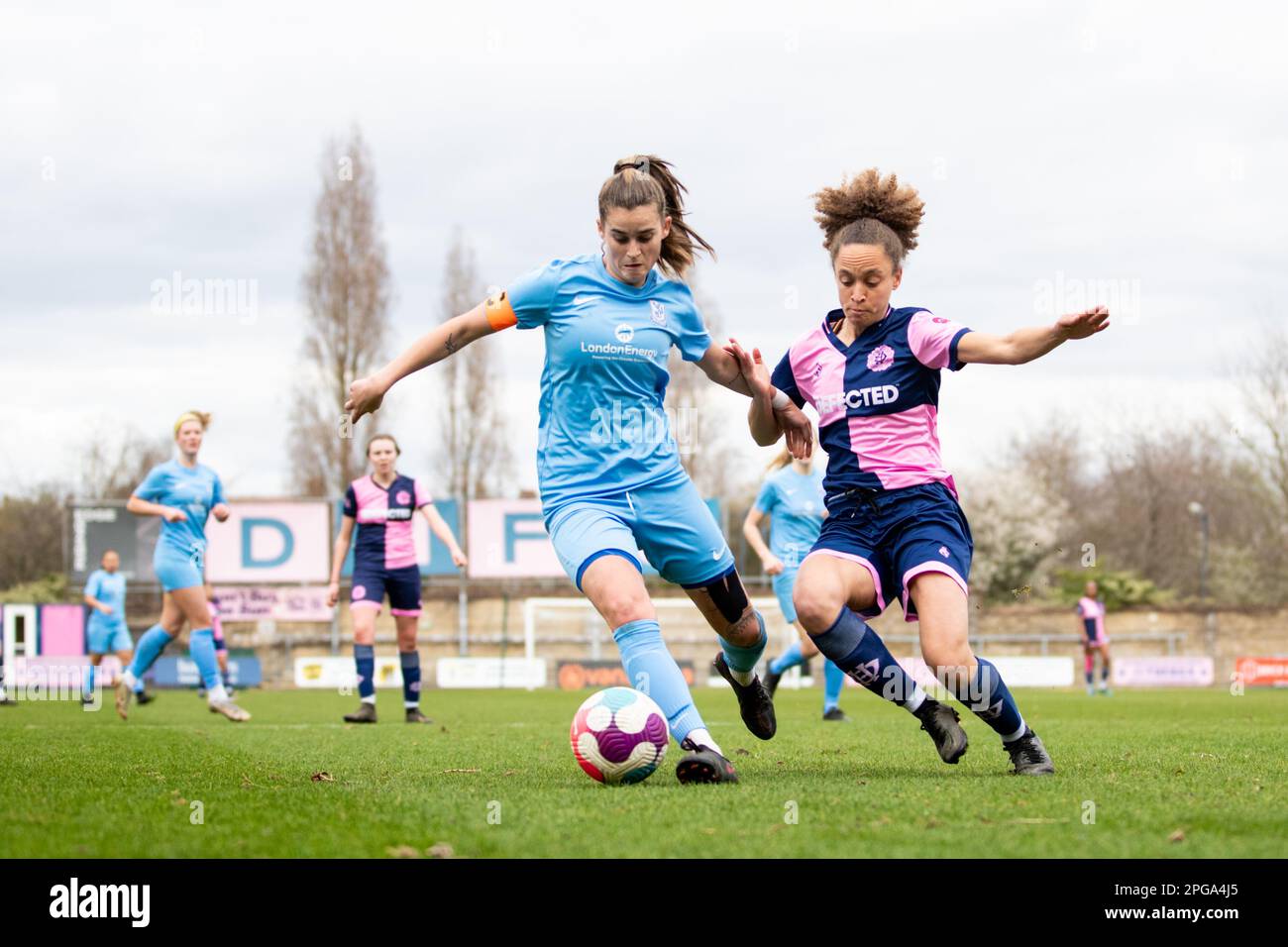 Female footballers from Enfield FC and Dulwich Hamlet FC in action Stock Photo