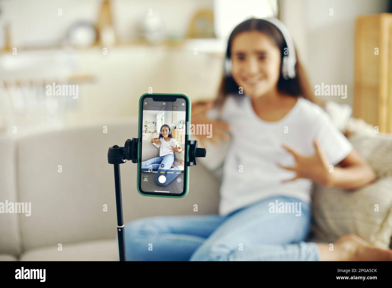Cell screen view pretty preteen 12s girl blogger record video for vlog ...