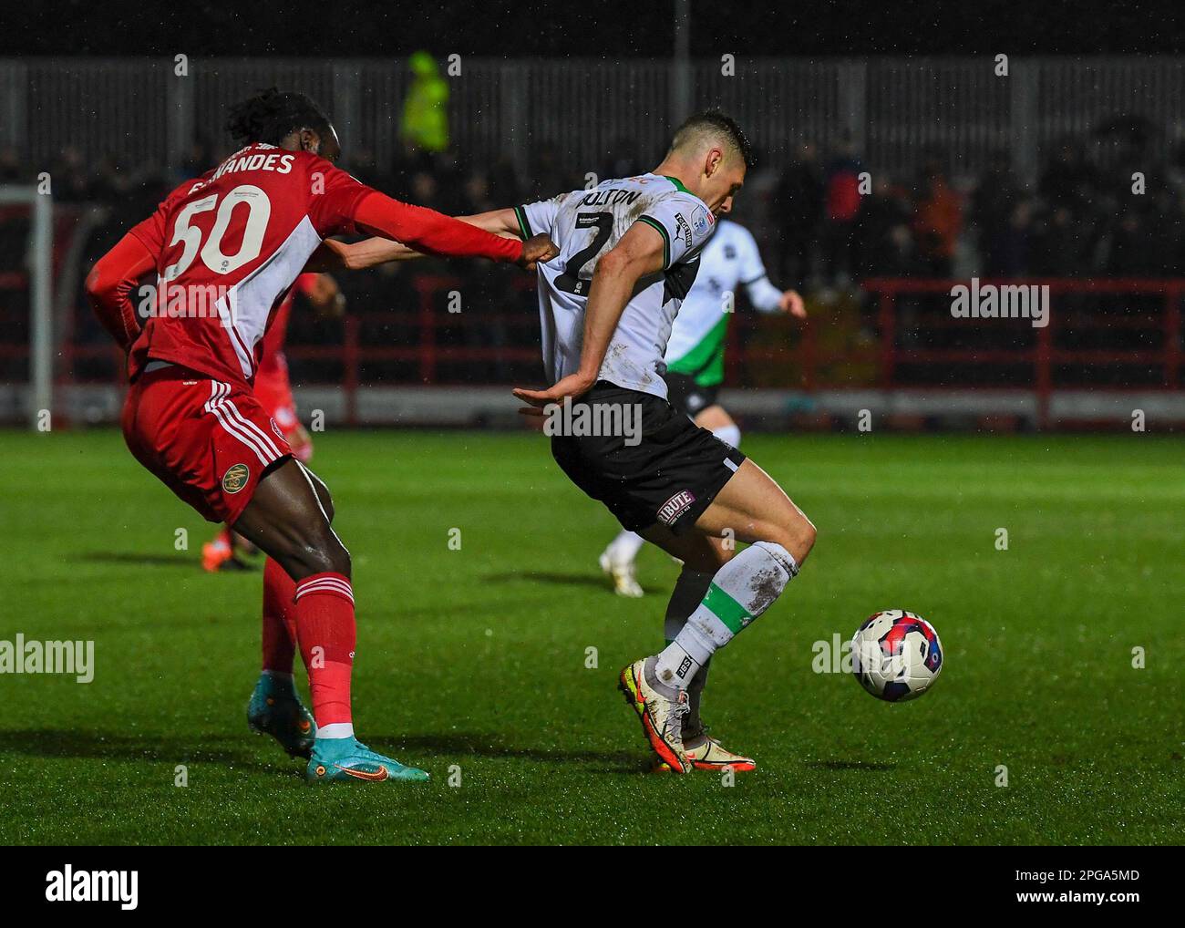 James Bolton #2 of Plymouth Argyle  shields the ball during the Sky Bet League 1 match Accrington Stanley vs Plymouth Argyle at Wham Stadium, Accrington, United Kingdom, 21st March 2023  (Photo by Stan Kasala/News Images) Stock Photo