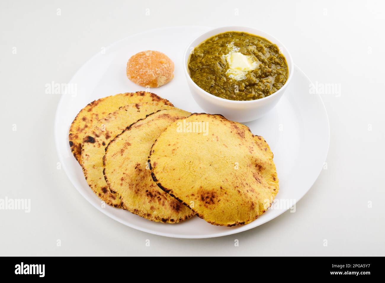 Saag with makki roti in plate on white background Stock Photo - Alamy
