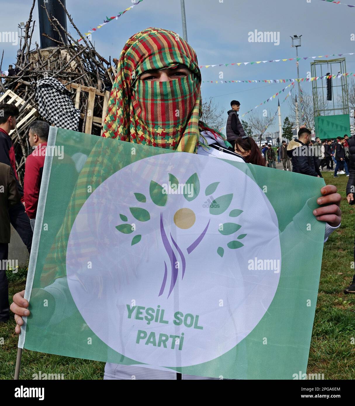 Diyarbakir, Turkey. 21st Mar, 2023. A Kurdish youth wearing a hijab with the national colors