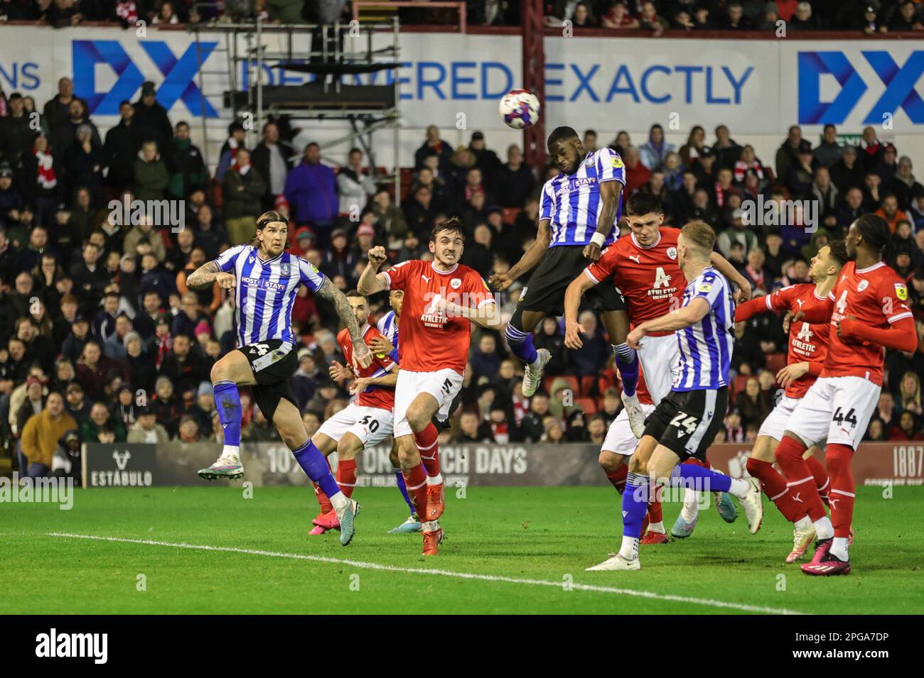 Dominic Iorfa #6 of Sheffield Wednesday heads on goal during the Sky Bet League 1 match Barnsley vs Sheffield Wednesday at Oakwell, Barnsley, United Kingdom, 21st March 2023  (Photo by Mark Cosgrove/News Images) Stock Photo
