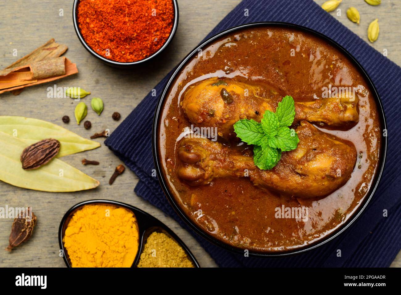 Spicy chicken curry with traditional indian spices Stock Photo - Alamy