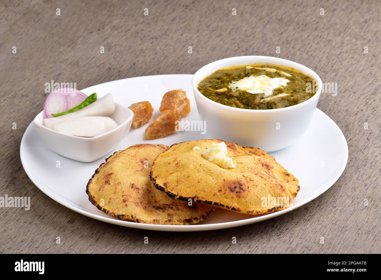 Saag with corn chapati served with jaggery, punjabi healthy dish Stock