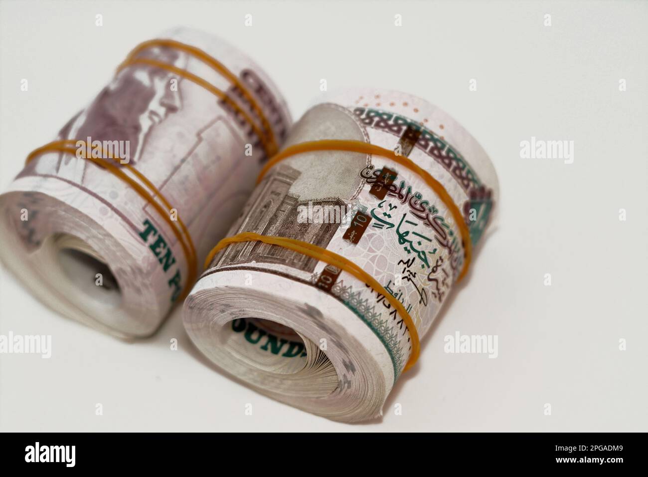 10 EGP LE ten Egyptian pounds cash money bills rolled up with rubber ...