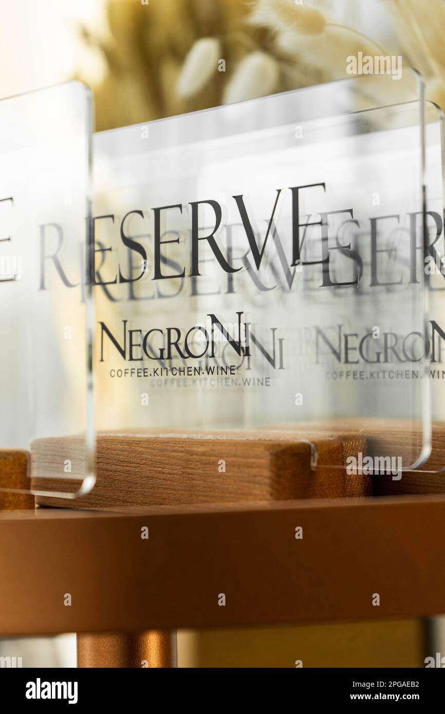 A close-up shot of a restaurant reservation stand  with a bold, black-lettered announcement Stock Photo
