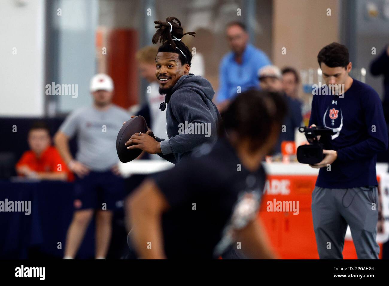 Former NFL and Auburn quarterback, Cam Newton, throws a pass