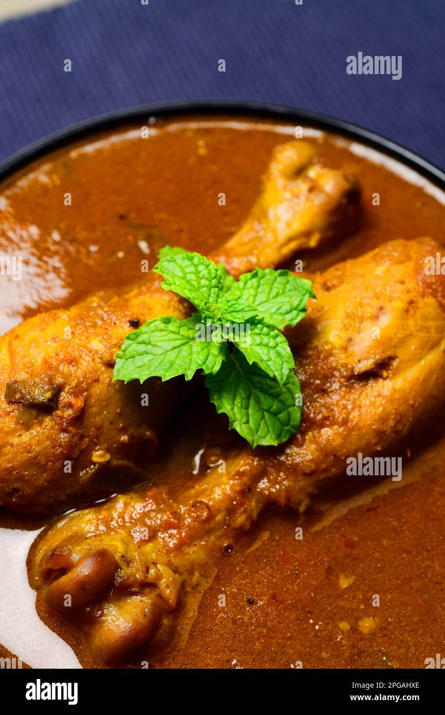 Tari wala murga spicy chicken leg piece curry Stock Photo Alamy