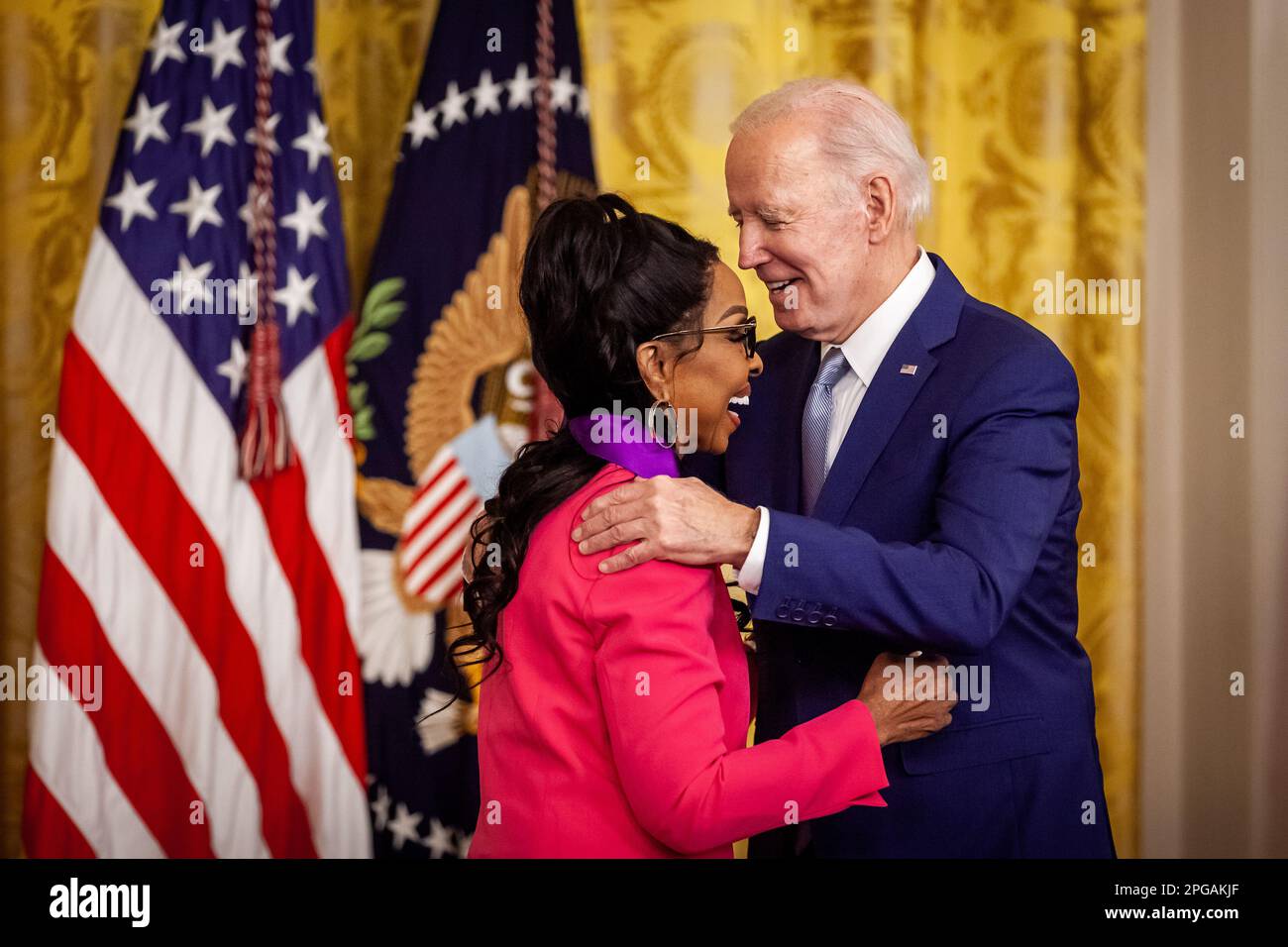 Washington, United States. 21st Mar, 2023. President Joe Biden hugs singer Gladys Knight after presenting her with the National Medal of the Arts during a White House ceremony awarding medals in the arts and humanities to 23 individuals. The event honored the 2021 recipients of the medals. The original award ceremony was postponed due to the coronavirus pandemic. Both medals are the highest honors given by the US government in the arts and humanities. (Photo by Allison Bailey/NurPhoto) Credit: NurPhoto SRL/Alamy Live News Stock Photo