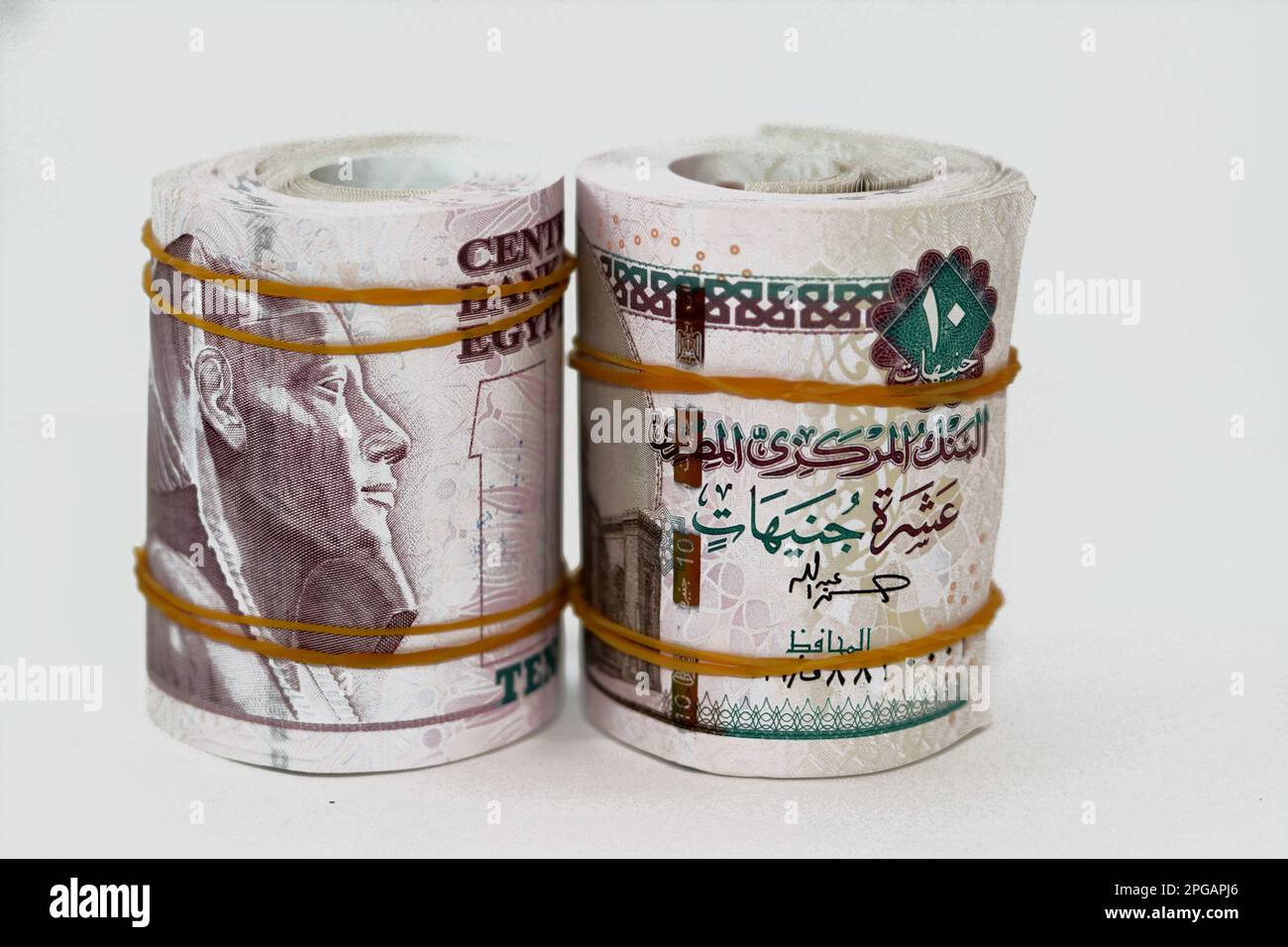 10 EGP LE ten Egyptian pounds cash money bills rolled up with rubber ...