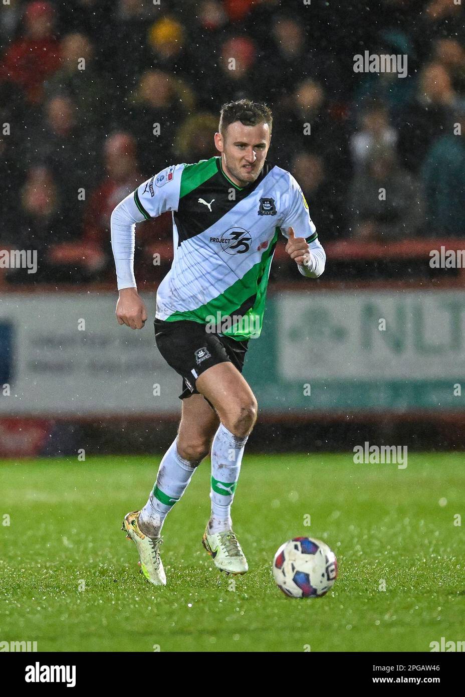 Macaulay Gillesphey #3 of Plymouth Argyle on the ball during the Sky Bet League 1 match Accrington Stanley vs Plymouth Argyle at Wham Stadium, Accrington, United Kingdom, 21st March 2023  (Photo by Stan Kasala/News Images) Stock Photo