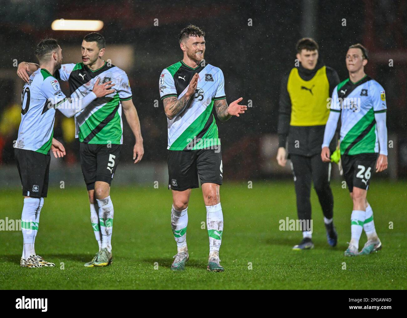 Dan Scarr #6 of Plymouth Argyle celebrates a win at full time during the Sky Bet League 1 match Accrington Stanley vs Plymouth Argyle at Wham Stadium, Accrington, United Kingdom, 21st March 2023  (Photo by Stan Kasala/News Images) Stock Photo