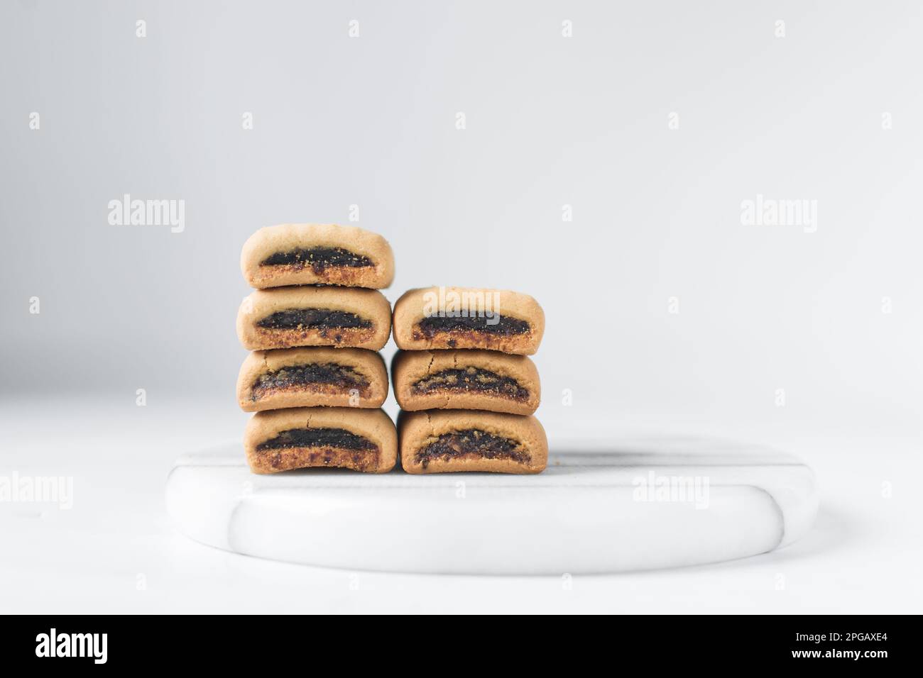 Date filled sugar cookies, homemade vanilla sugar cookies with a date filling, date bar cookies, homemade maamoul cookie bars Stock Photo