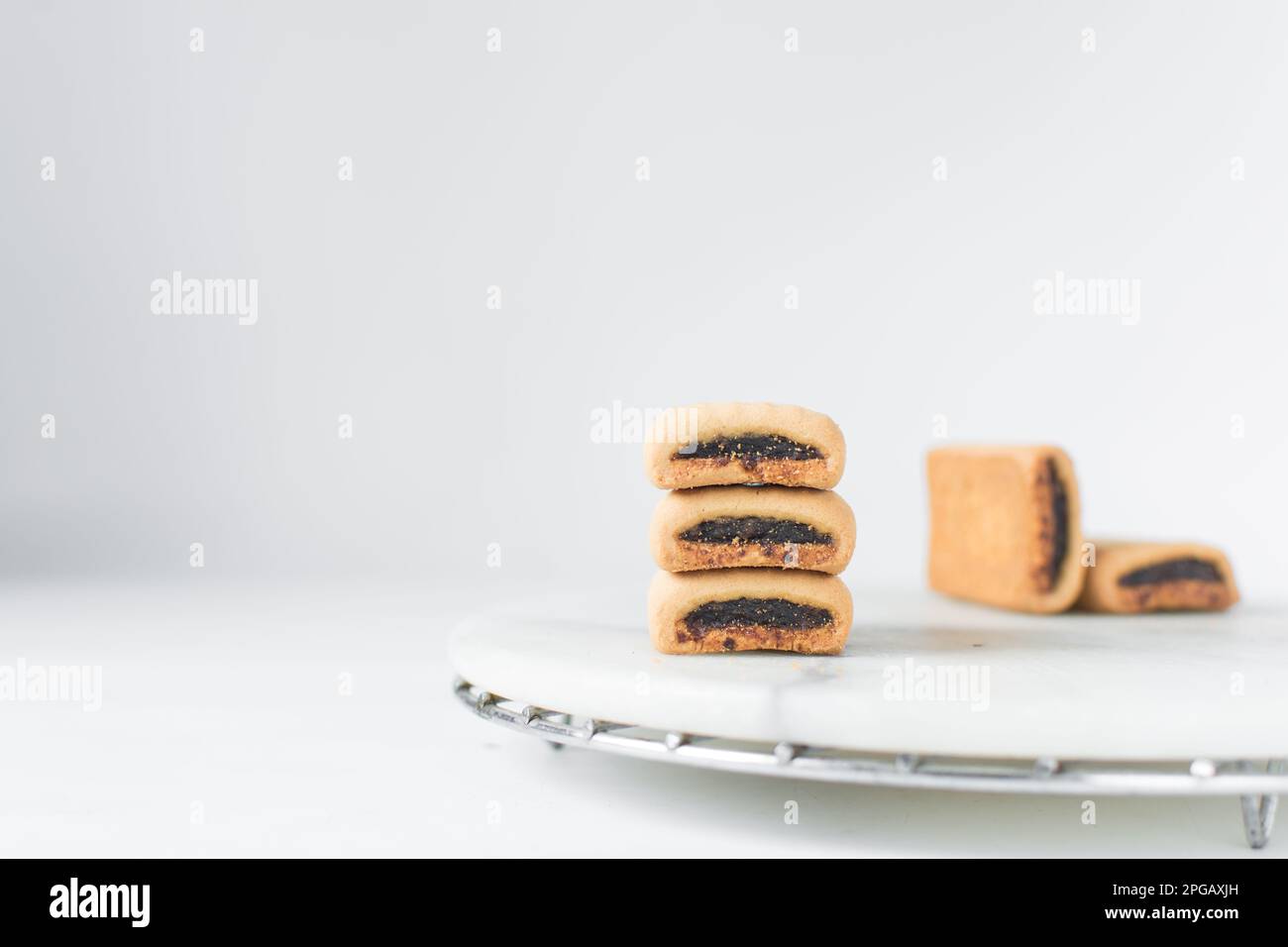 Date filled sugar cookies, homemade vanilla sugar cookies with a date filling, date bar cookies, homemade maamoul cookie bars Stock Photo