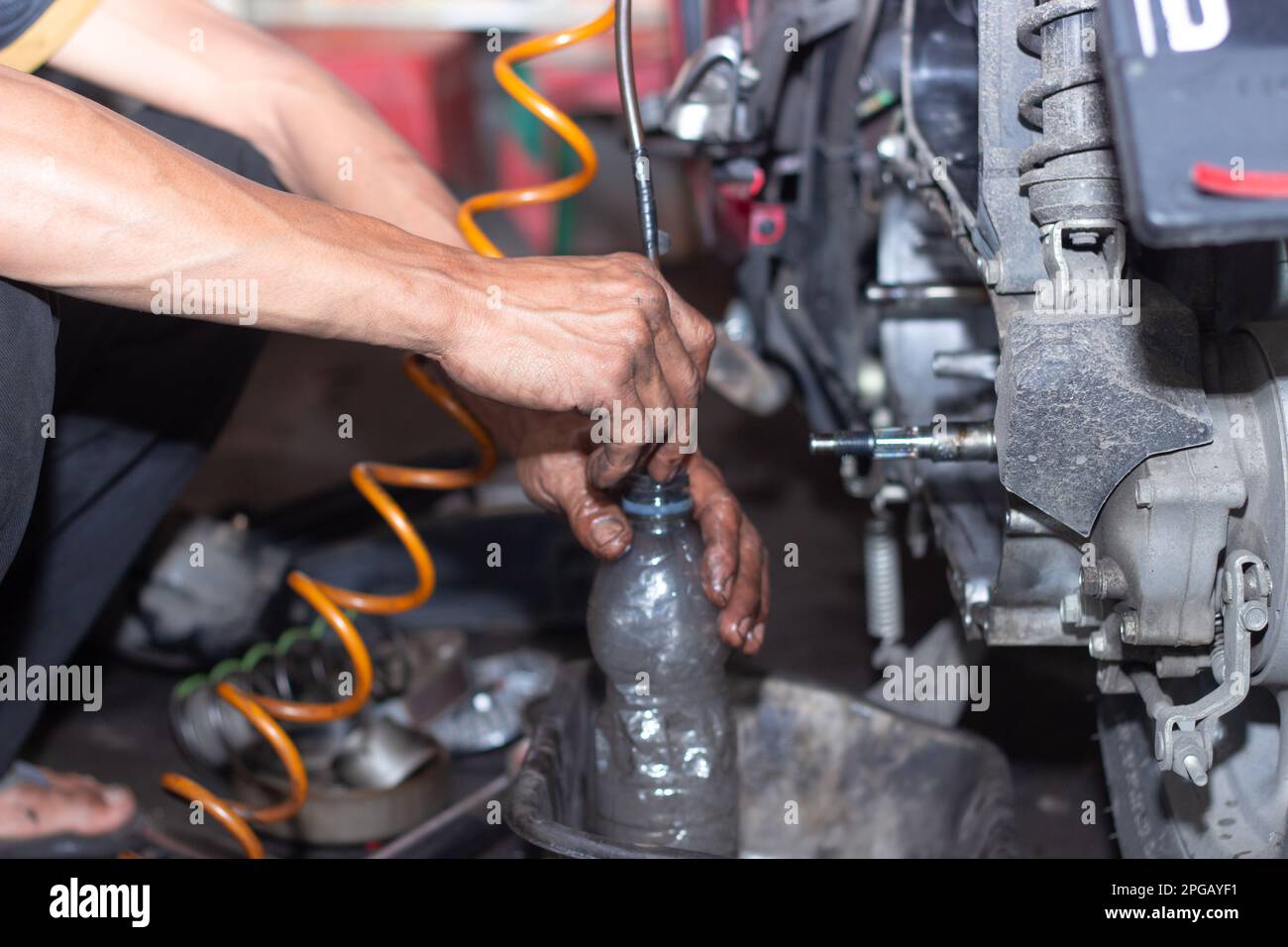 Motorcycle mechanic check the condition of Auto Transmission system or