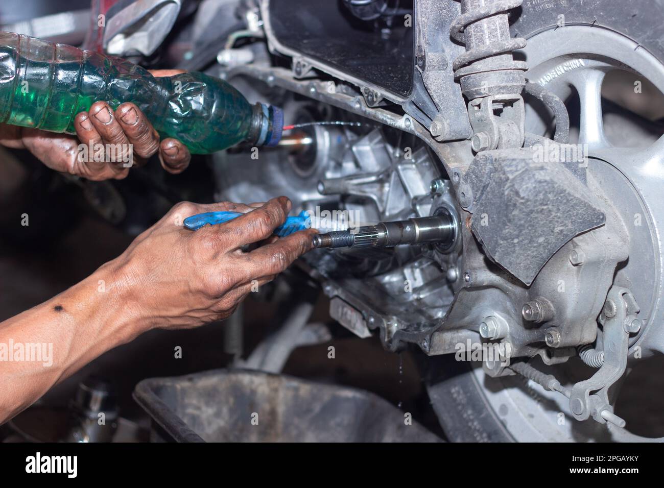Motorcycle mechanic check the condition of Auto Transmission system or