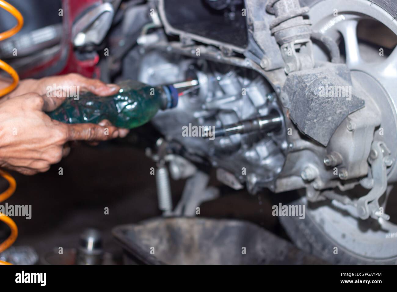 Motorcycle mechanic check the condition of Auto Transmission system or