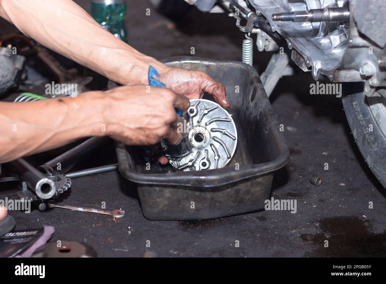 Motorcycle mechanic check the condition of Auto Transmission system or