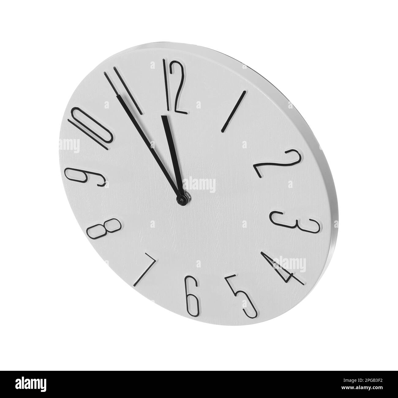 Clock showing five minutes until midnight on white background. New Year