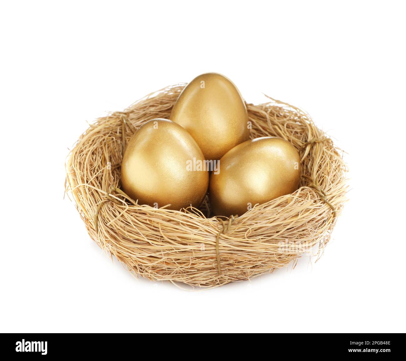 Shiny golden eggs in nest on white background Stock Photo - Alamy