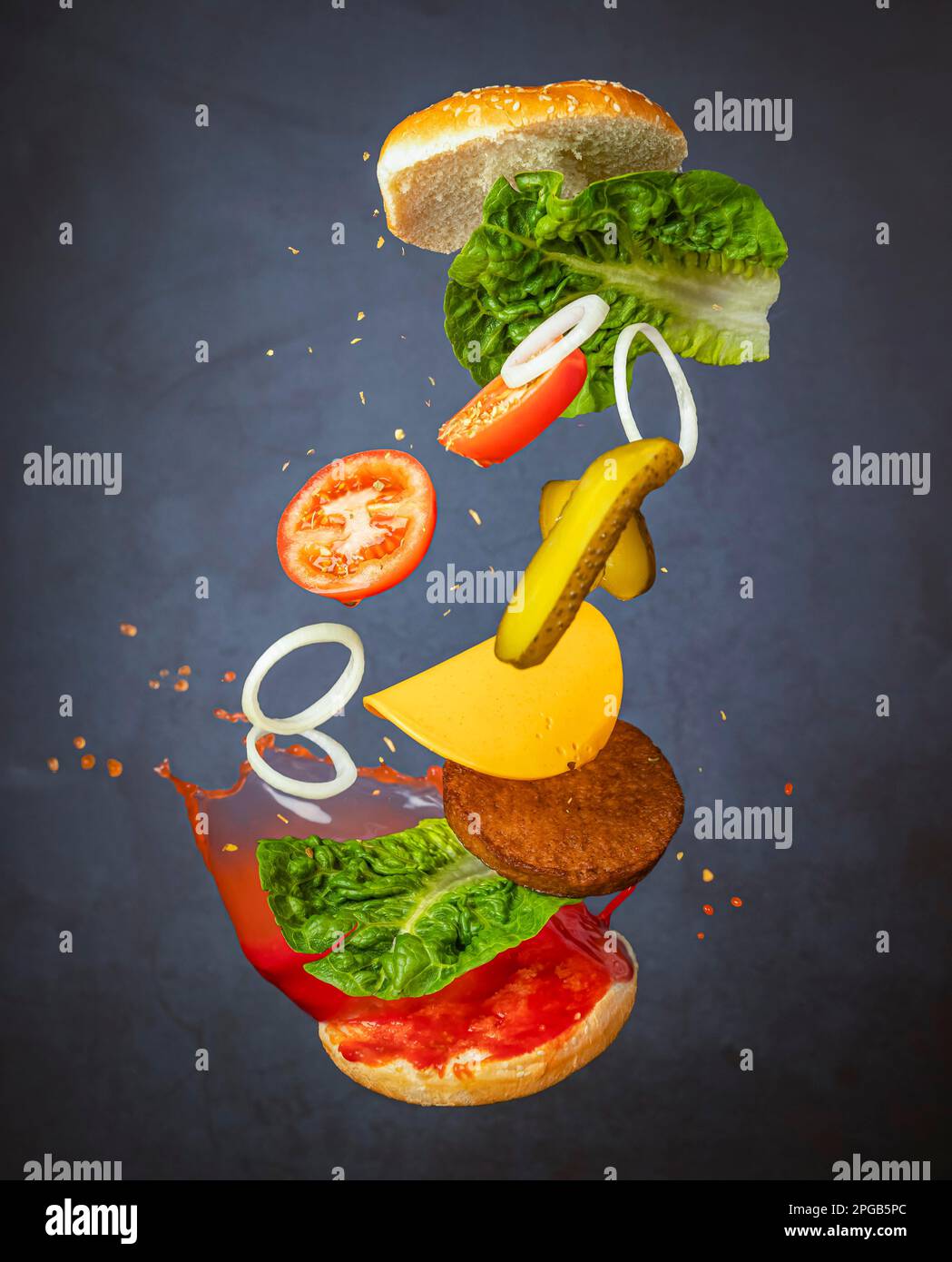 Flying hamburger, flying food, food photography, dark background Stock