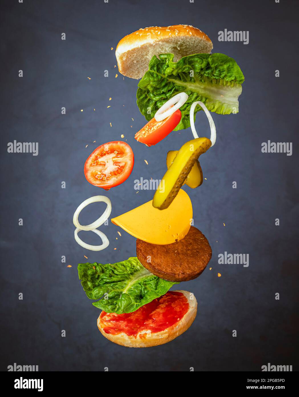 Flying hamburger, flying food, food photography, dark background Stock Photo