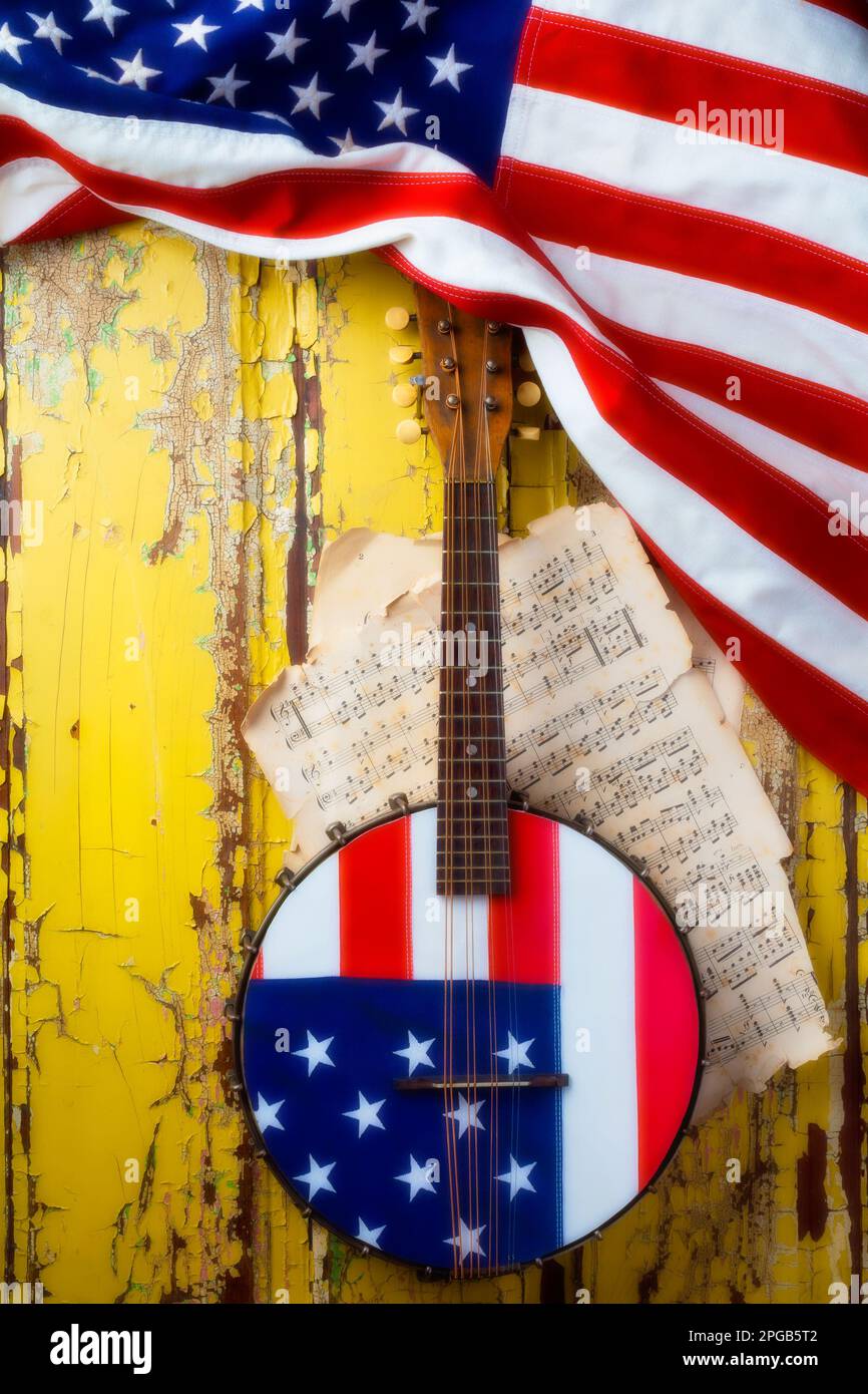 American Banjo With American Flag, hanging on on rustic weathered paint