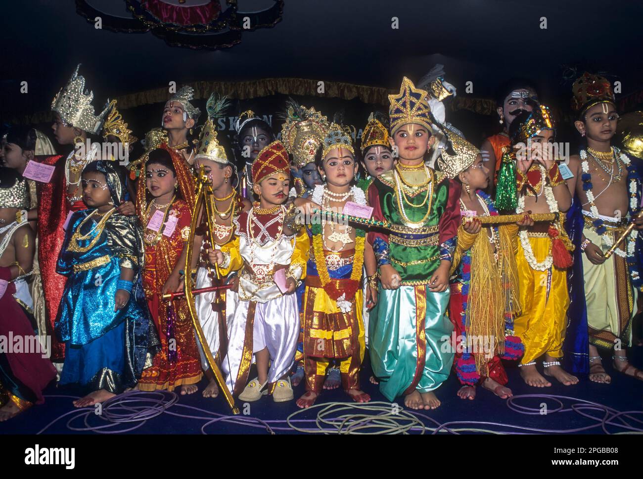 Boy and a girl in costumes in a religious festival of Krishna