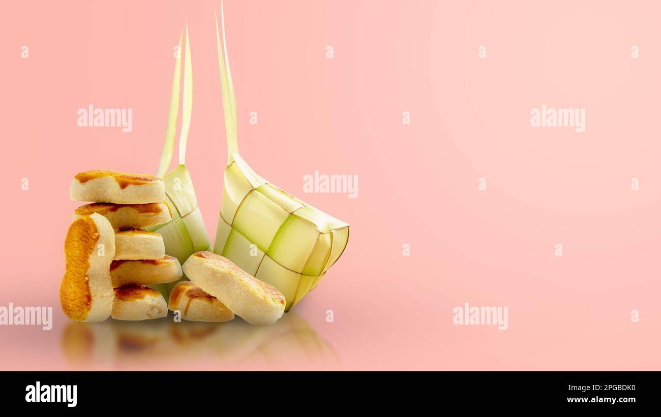 Indonesian cookies and Ketupat (Rice Dumpling) to celebrate eid al fitr (Kue Lebaran) on a colored background Stock Photo