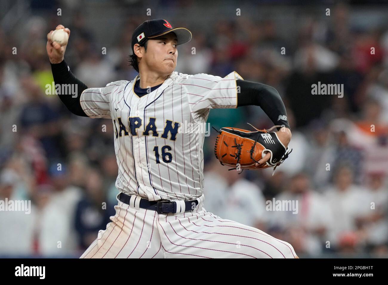 Japan pitcher Shohei Ohtani (16) aims a pitch during the ninth