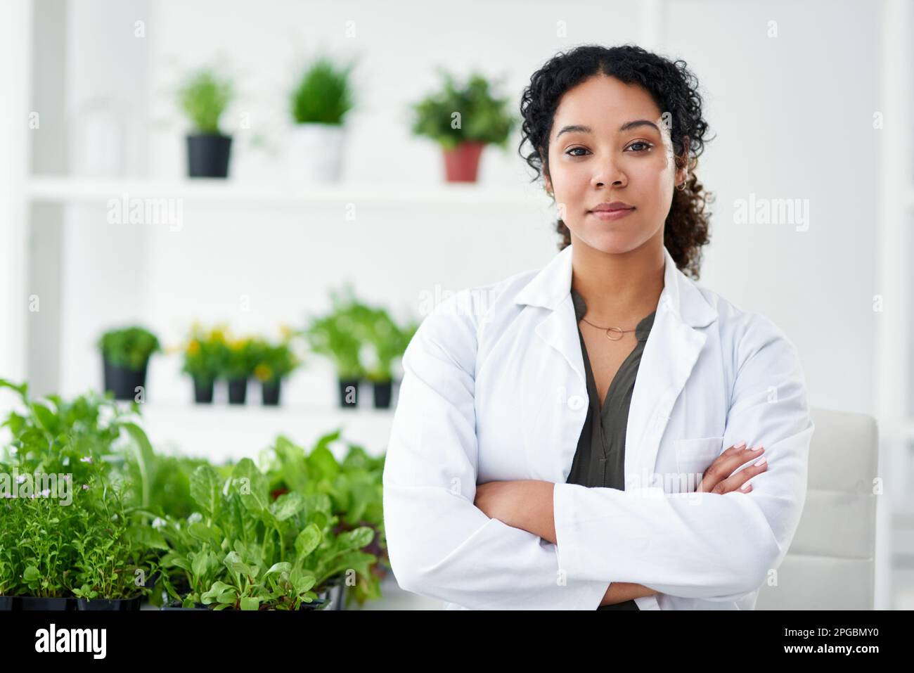 Im helping to grow a better future. Portrait of a female scientist standing in her lab. Stock Photo