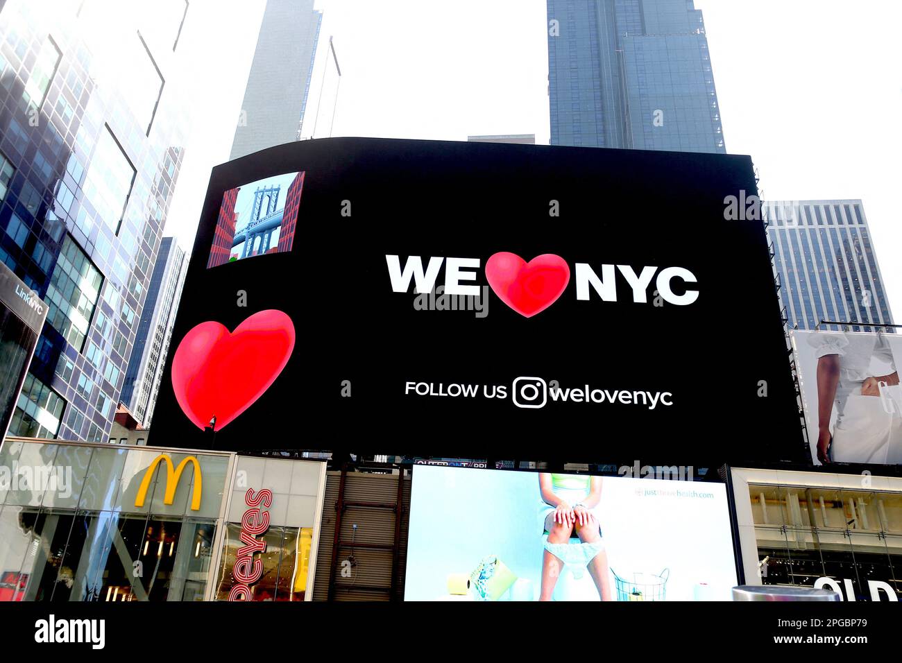 New York City, United States. 21st Mar, 2023. We Love NYC new logo on giant billboards in Times Square, New York City, NY, USA on March 21, 2023. Officials unveiled new logo for New York to replace the most iconic 'I Love NYC' designed by Milton Glaser for a 1977 campaign to promote tourism in New York State. Photo by Charles Guerin/ABACAPRESS.COM Credit: Abaca Press/Alamy Live News Stock Photo