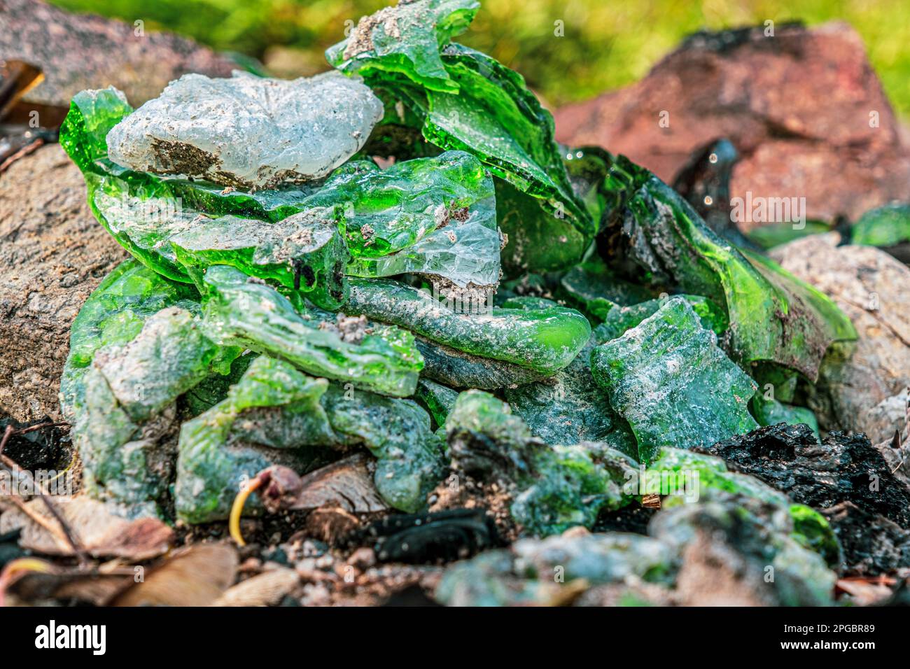 pieces of melted broken glass in nature Stock Photo Alamy